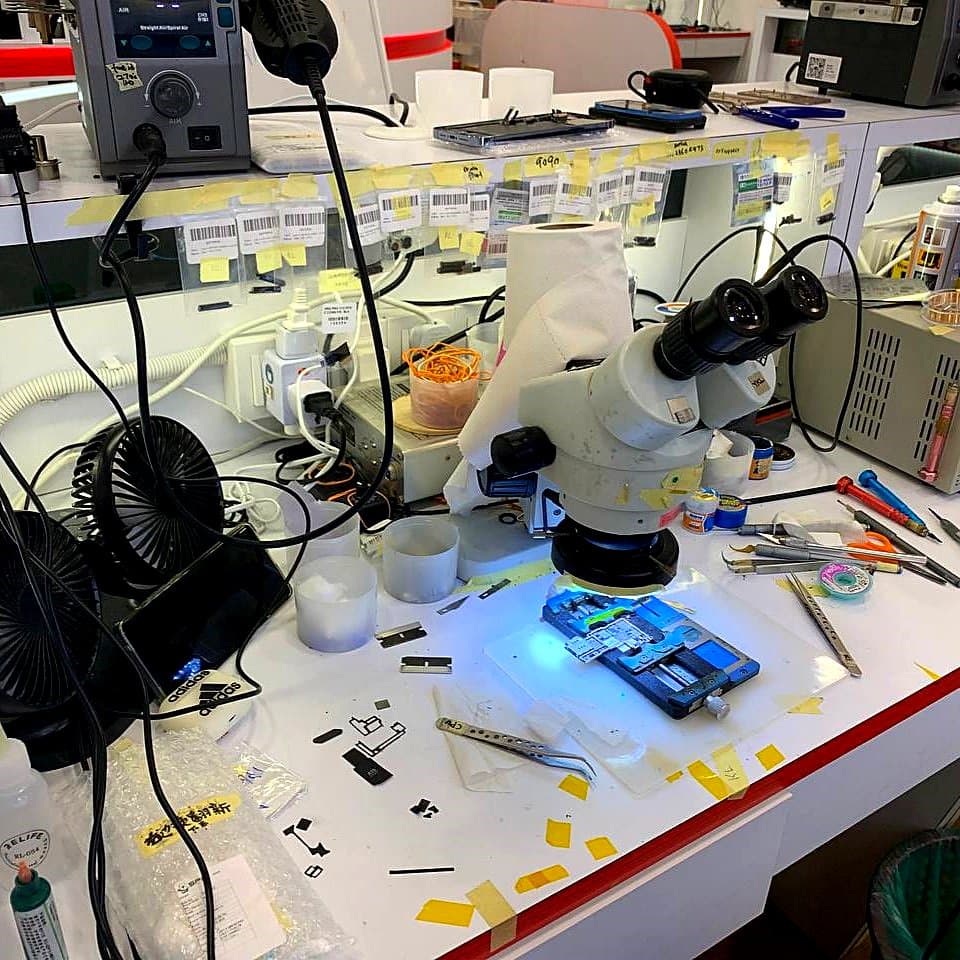Student soldering on a logic board